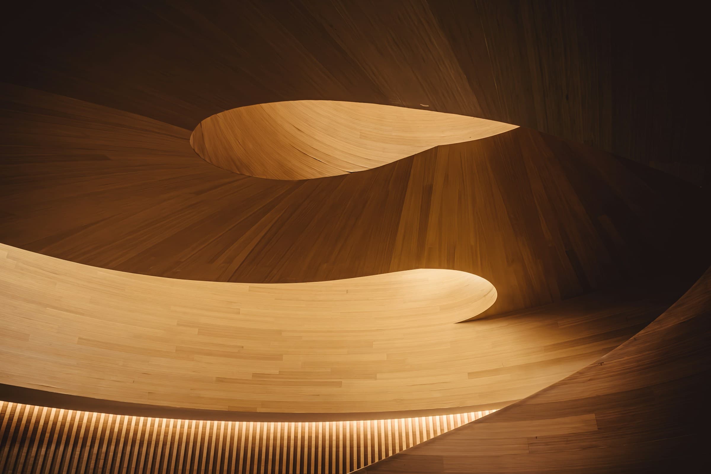 Sculptural curved wood interior with thin wooden veneers swirling in warm tungsten light